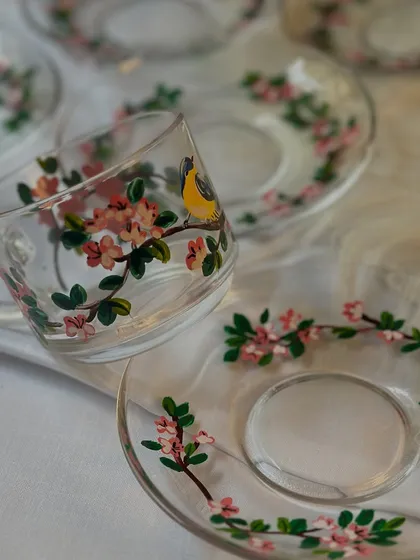 Your daily chai deserves a beautiful cup. I painted these delicate glass cups and saucers with a cherry blossom and bird design, perfect for making your tea time a little more special.