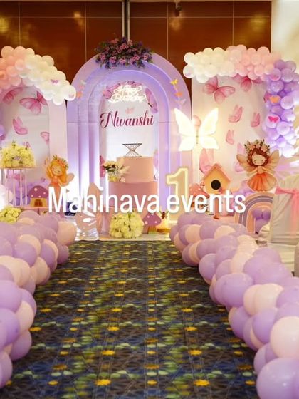 The entrance to a fairy-themed party, with a balloon-lined aisle leading to the main stage. This creates a grand and welcoming experience for guests as they arrive.
