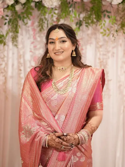 A final smiling portrait of the bride-to-be, looking happy and ready for her new journey.