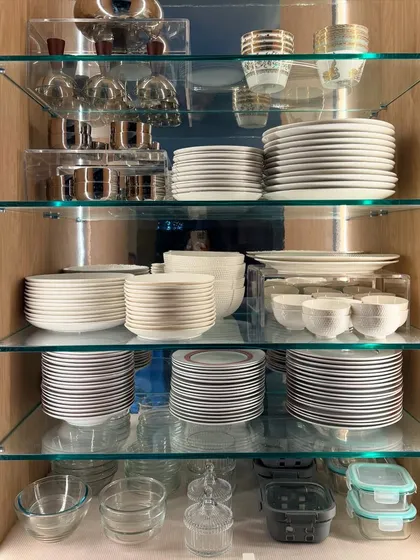 Your beautiful crockery deserves to be seen and used, not hidden away. We use strategic placement and acrylic risers to turn your cabinets into an elegant display that is also practical for daily use.