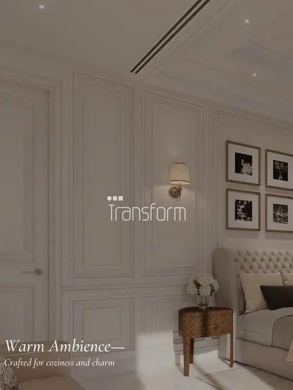 A detail shot of a bedroom designed for a warm ambiance. The classic wall paneling, tufted headboard, and soft wall sconce lighting are crafted for coziness and charm.