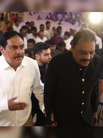 A distinguished guest arriving in our classic black Jodhpuri suit. This timeless piece is perfect for adding a touch of Indian royalty to a formal event.