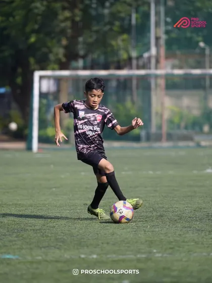 A player shows great dribbling form and balance on the field.