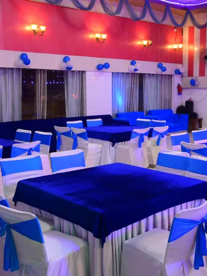 For this event, the client wanted a blue and white theme. I provided tables with royal blue velvet cloths and chairs with matching blue sashes.
