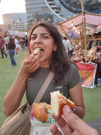 A happy customer trying one of my Korean Cream Cheese Buns at The Lil Flea. I love meeting my customers at pop-ups.