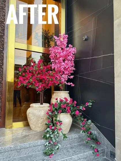 This is the 'after' shot, showing the complete transformation. I used a mix of faux bougainvillea and cherry blossom trees to create a layered, colorful, and grand display.