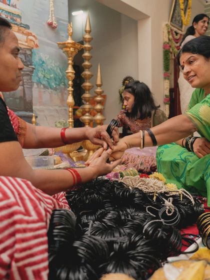 The Bale Shastra, or bangle ceremony, is a beautiful tradition. I ensure the decor complements the intimacy of the moment, with traditional elements like brass lamps and floral arrangements surrounding the family.