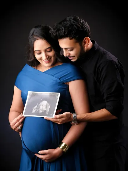 The first hello. Holding up the sonogram picture is a classic and deeply emotional moment in any maternity shoot, connecting you with the little one you are so excited to meet.