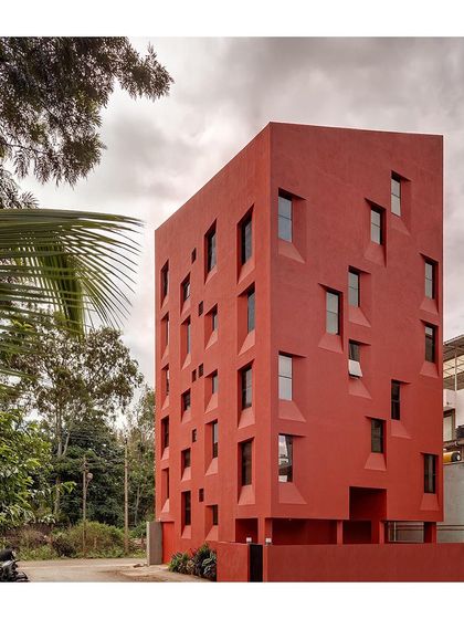 Another view of the "Stacked Student Housing" project, highlighting the deep recesses of the windows. These recesses provide shade and privacy for the students living inside.