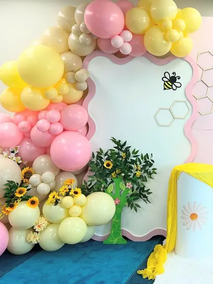 We use different shapes and sizes of balloons to create texture and visual interest in our organic garlands.