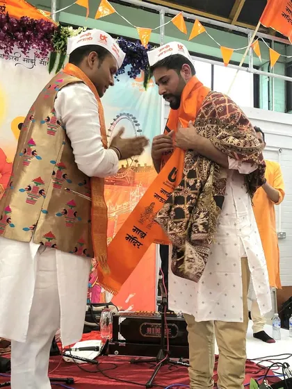 Being felicitated at a concert for the Shree Vitthal Rukmini Temple Trust in the UK. It's always an honor to receive blessings from the community.