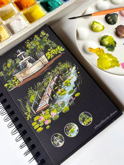 The completed two-page spread in my black sketchbook, featuring the fountain and the lily pond bridge. It feels like a walk through a peaceful, magical garden.
