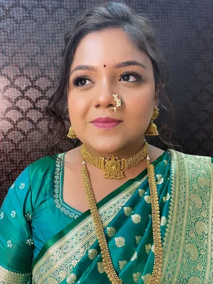 A portrait of the bride looking radiant and happy. The subtle glam makeup enhances her features without overpowering her, creating a look of pure elegance.