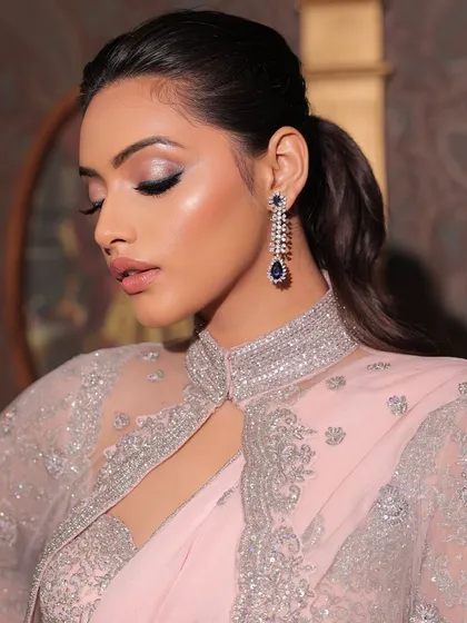 A moment of quiet glamour. This shot highlights the beautiful shimmer on the eyelids and the soft, blended quality of the smokey eye makeup.