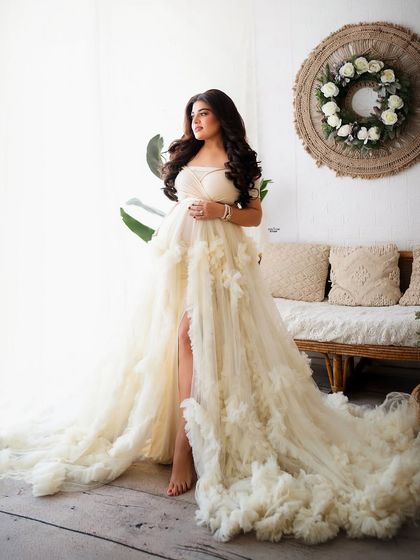 A full-length shot showcasing the incredible texture and flow of this boho-chic ruffled gown. It's a true statement piece.