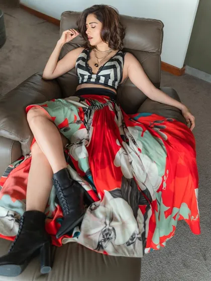 Ready for a pool party! I styled Nushrratt Bharuccha in this edgy look, pairing a bold floral skirt with a striped crop top and combat boots for a fun, high-fashion contrast.