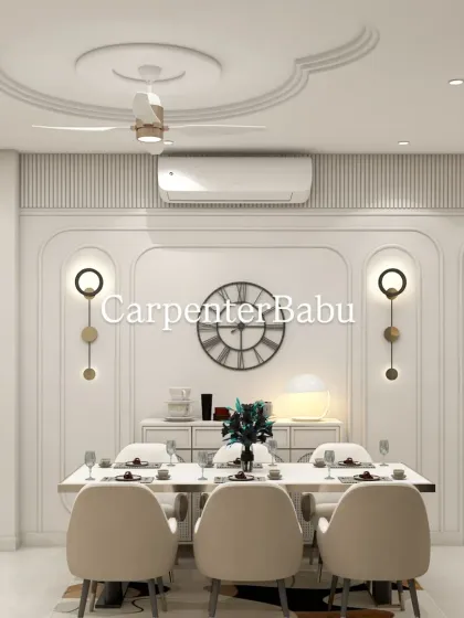 The dining area in the same apartment, featuring a six-seater table set against a beautifully paneled wall with modern sconces.