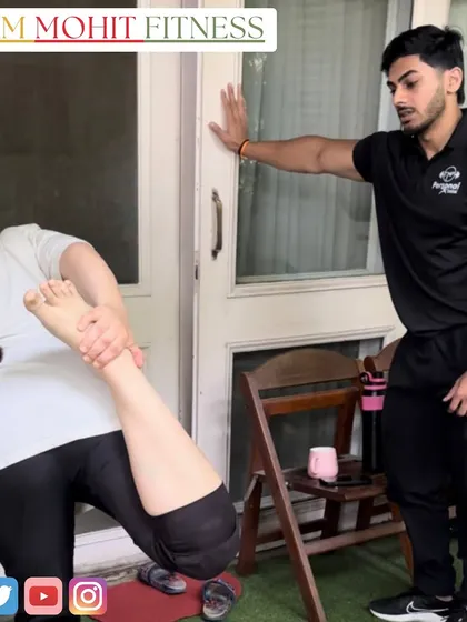Assisting a client with a quad stretch at home. Proper stretching and flexibility are key components of my training programs for injury prevention and recovery.