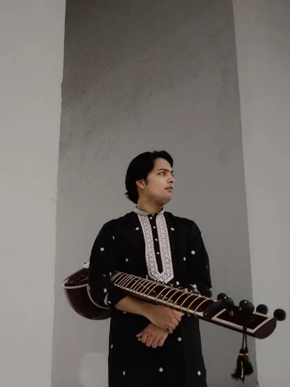 A more composed shot from the same photoshoot, holding my sitar.