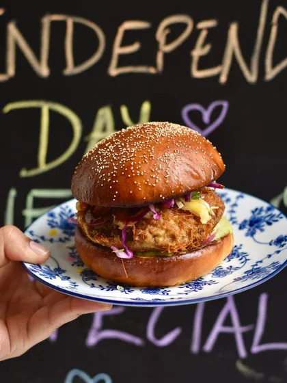 The Irani Fried Chicken Sandwich, our tribute to the iconic Russian cutlets from old Irani cafés. We serve a crispy chicken cutlet on our house-made brioche bun with a tangy slaw.