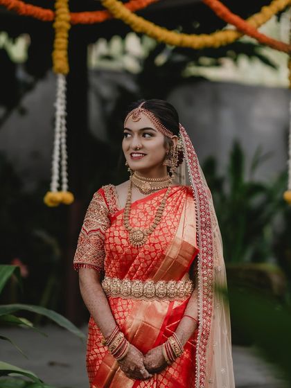 A candid side profile of Tanu, capturing her natural beauty and the elegance of her bridal attire.