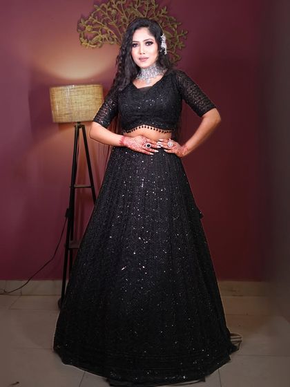 A full-length shot of the black sequin outfit, showing its flattering A-line silhouette.