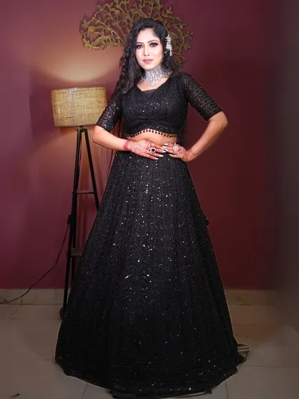 A full-length shot of the black sequin outfit, showing its flattering A-line silhouette.