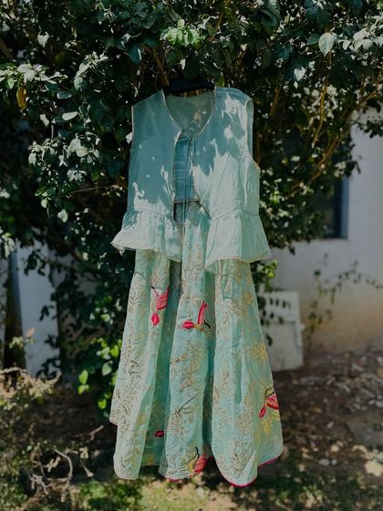 This pastel green lehenga set is perfect for summer weddings. The lightweight fabric and delicate embroidery are designed to keep your little one cool and comfortable while looking effortlessly elegant.