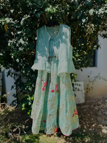 The mint green version of my peplum top lehenga. The skirt features a lovely bird and floral print, perfect for a garden party.