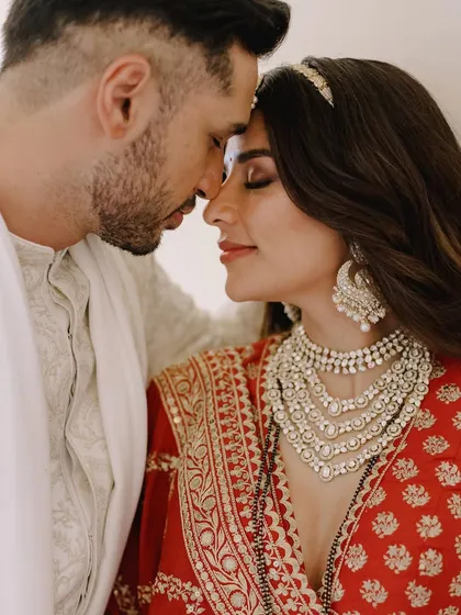 Styling my dear friend Carla Dennis for her wedding to Arjun Kanungo was an absolute dream. This intimate moment captures the emotion of the day. Her stunning red Sabyasachi lehenga was the centerpiece of her bridal trousseau.