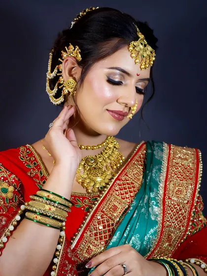 A side profile showcasing the elegant bun, hair accessories, and the contour of the makeup.