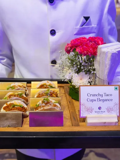 Crunchy Taco Cups Elegance. Our server presents a tray of these delightful Mexican-inspired appetizers, perfectly portioned for mingling.