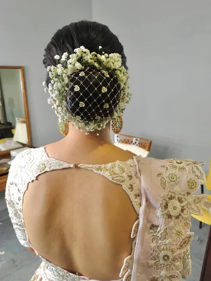Another angle of the baby's breath net bun, a truly stunning and memorable bridal hairstyle.