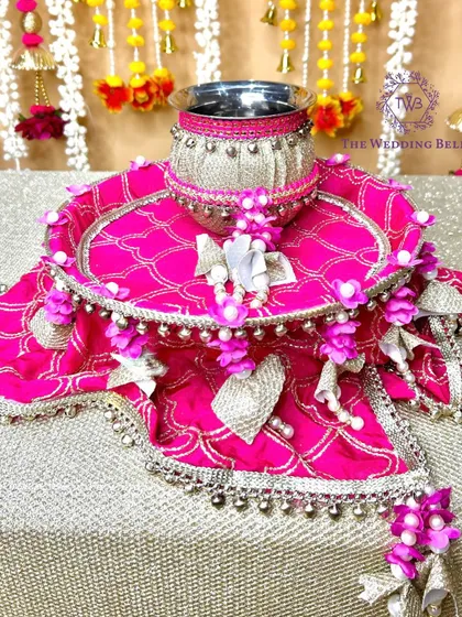 The complete 'CHAAND' thali set in pink, without the sieve, showcasing the beautiful base and decorated lota.
