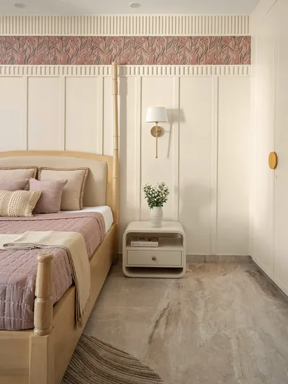 Another view of the master bedroom from the Casa Levante project, highlighting the soft, organic feel of the space. The design uses a palette of warm whites with blush undertones.