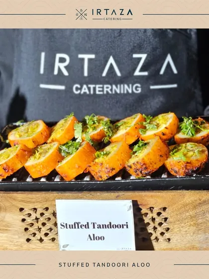 Service is paramount. My professional team, seen here presenting Stuffed Tandoori Aloo, is trained to be attentive, polite, and ensure a seamless experience, allowing you to relax and enjoy your own event.