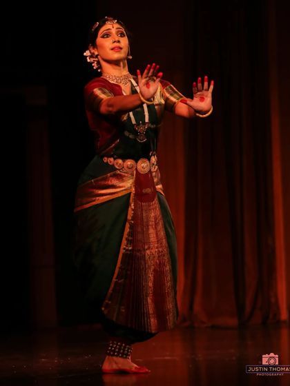 A classic Bharatanatyam stance, showcasing the geometric lines and precision that define the 'nritta' or pure dance aspect of the art form.