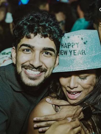 A couple celebrating together at our NYE party. Our events provide a perfect setting for creating special memories with loved ones.