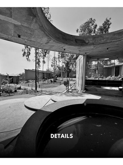 A detail shot of the resort's curved water feature and interlocking circular platforms, showcasing the project's geometric and sculptural qualities.