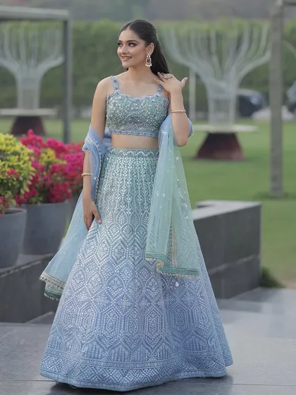 Another view of the ice blue lehenga, showcasing its beautiful ombre dupatta that transitions from light blue to mint green.