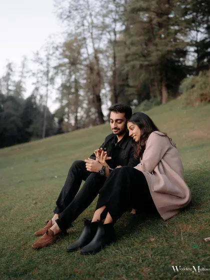 A quiet, contemplative moment for Harshit and Aayushi. Sitting together on a grassy hill, this shot captures the peaceful side of their relationship.