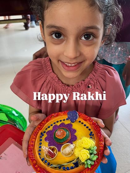 "Happy Rakhi!" This student shows off her colorful and intricate Rakhi thali.