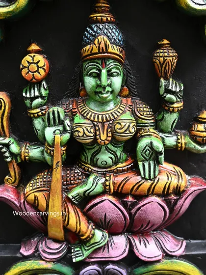This close-up shows the green-hued goddess from the AshtaLakshmi panel, representing fertility and nature. The fine lines and careful shading are evidence of our skilled painters.