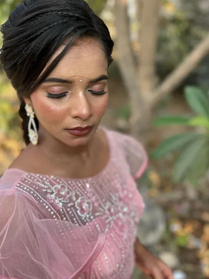 A duplicate of image 166, an outdoor shot in the golden hour light. The highlighter on her cheekbones catches the sun beautifully, creating a stunning glow.