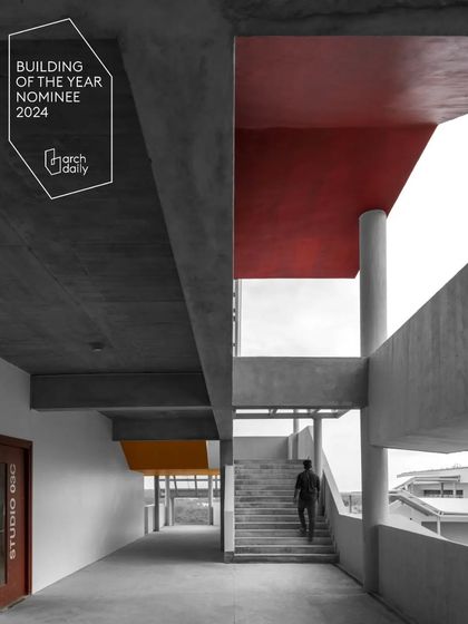 The architecture of MSAP is a composition of raw concrete and bold color accents. This view highlights the interplay of horizontal and vertical planes, creating a layered and visually complex facade.