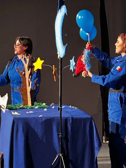 The stage of 'Volar Volar' is set with a starry backdrop and simple props. The show is a thought-provoking journey to develop a deeper understanding of the world.