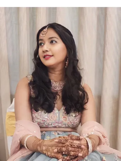 A close-up of our client looking lovely in the powder blue floral lehenga. The matching maang tikka and necklace complete the look perfectly.