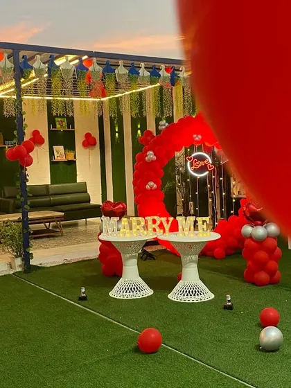 A slightly different perspective of the rooftop proposal setup, showing the surrounding seating area. I can decorate the entire space to make it feel cohesive and special for your guests.