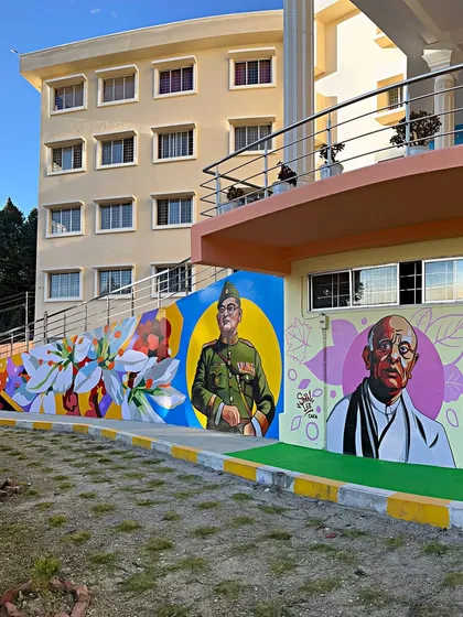 This 100-foot mural at St. Claret College in Ziro was an epic project. It features portraits of Indian freedom fighters and vibrant floral patterns, celebrating history and art on a massive scale for the entire community to see.