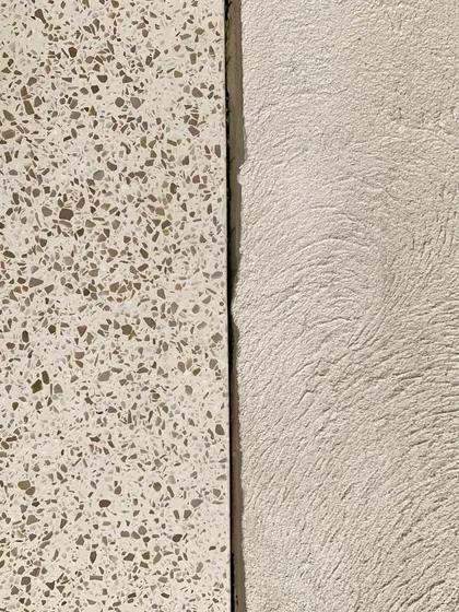 A material palette inspiration from our House of Galleries project in Kutch. The image shows the contrast between textured terrazzo flooring and rough lime plaster, materials chosen for their durability and aesthetic appeal.